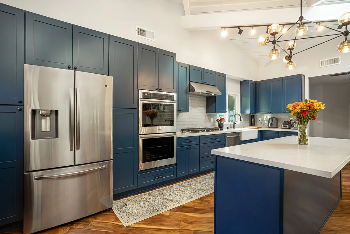 Finished kitchen remodeling project with custom cabinetry and stone surfaces