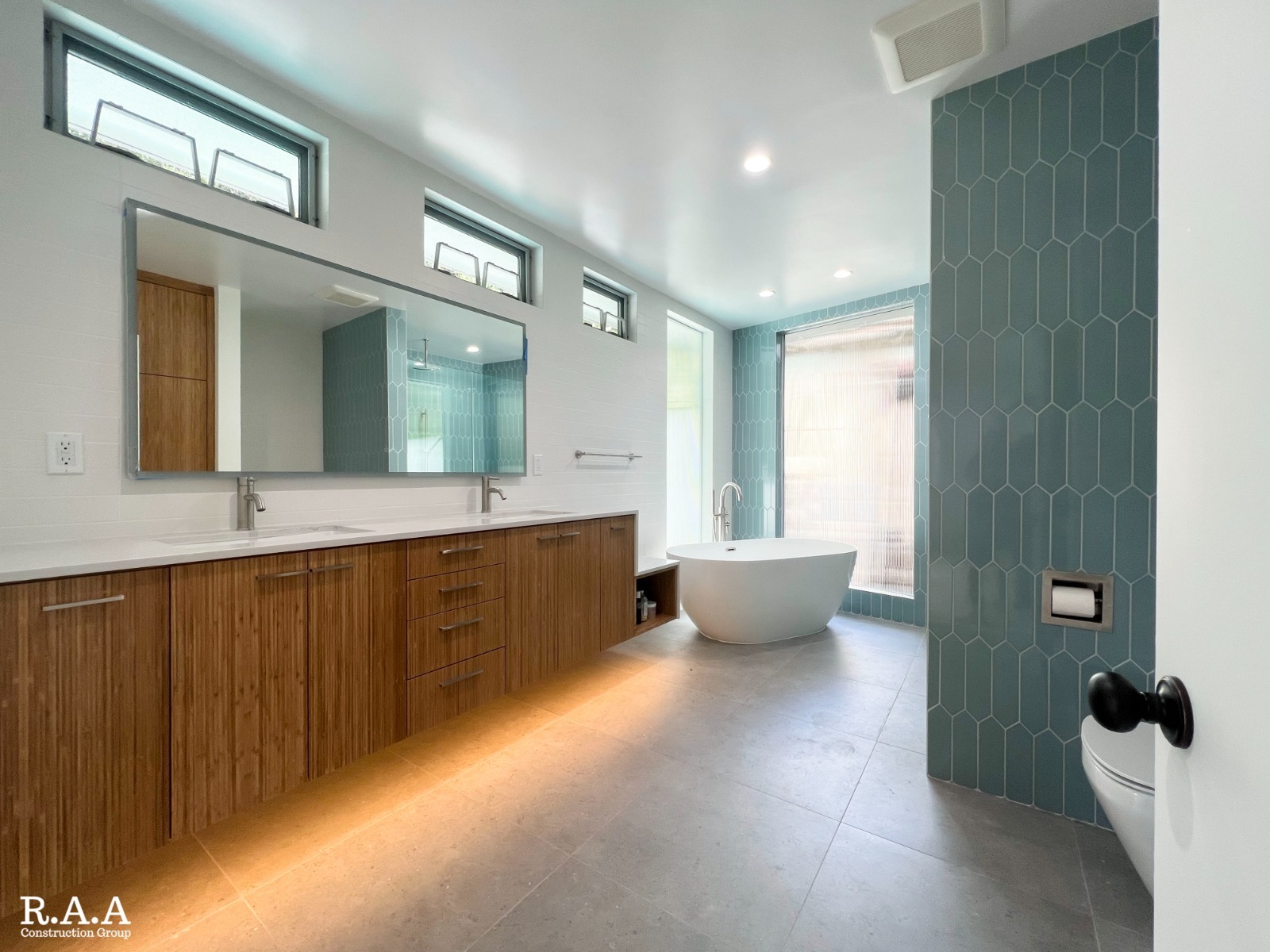 Remodeled bathroom with refined tile, fixtures, and finishes